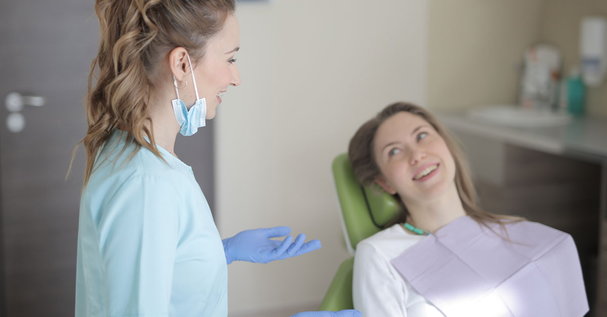 patient enquiring about root canals from dentist at the clinic